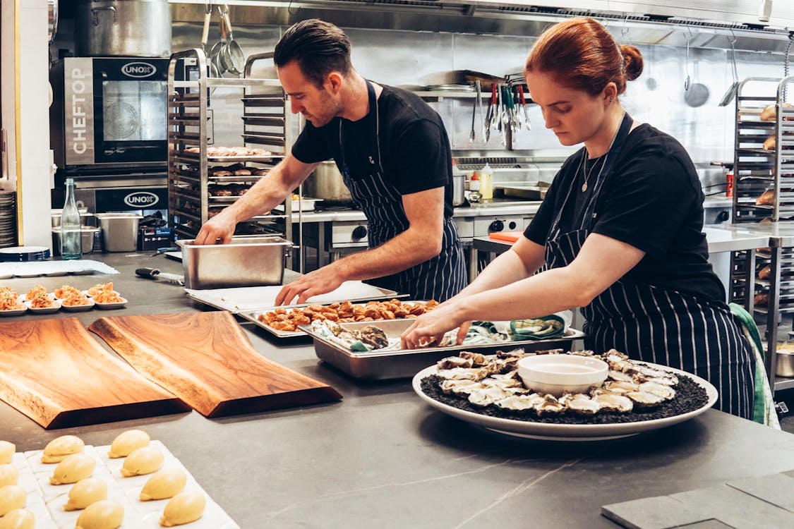 Culinary student gaining hands-on experience in a professional kitchen abroad